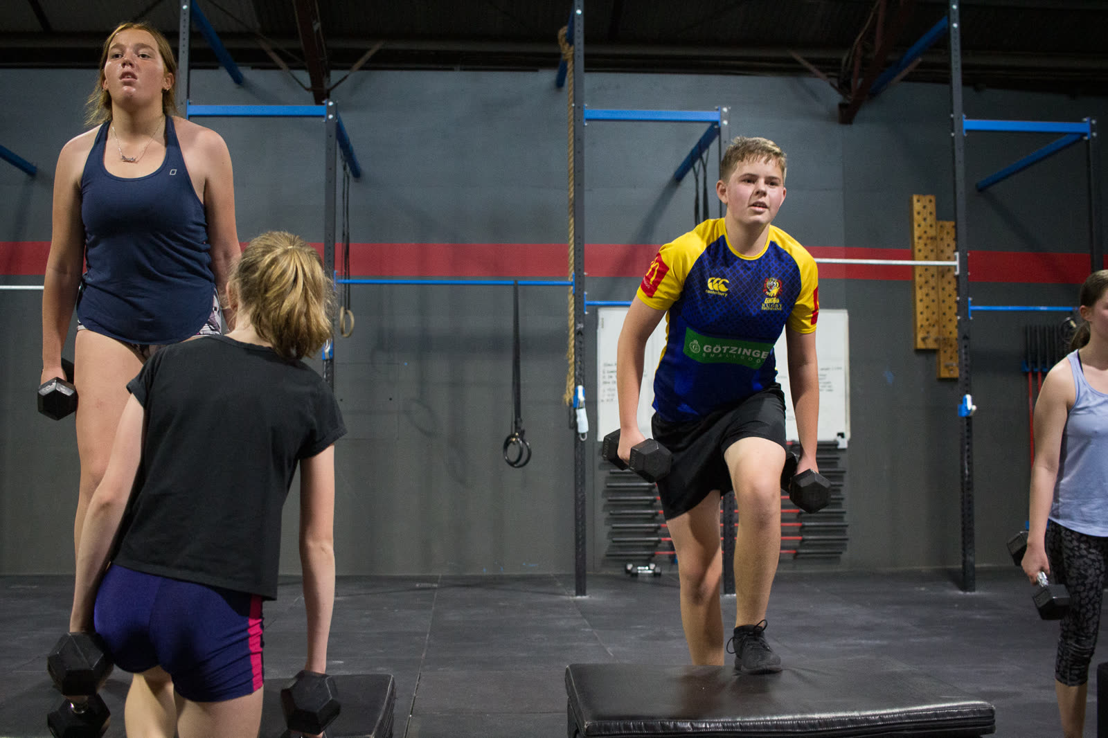 CrossFit Brisbane teens building confidence with dumbbell step-ups
