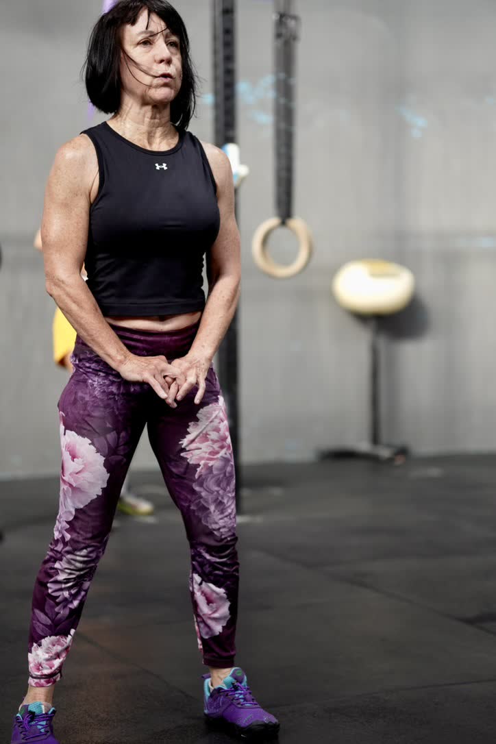 CrossFit Brisbane member standing ready during a coached training session